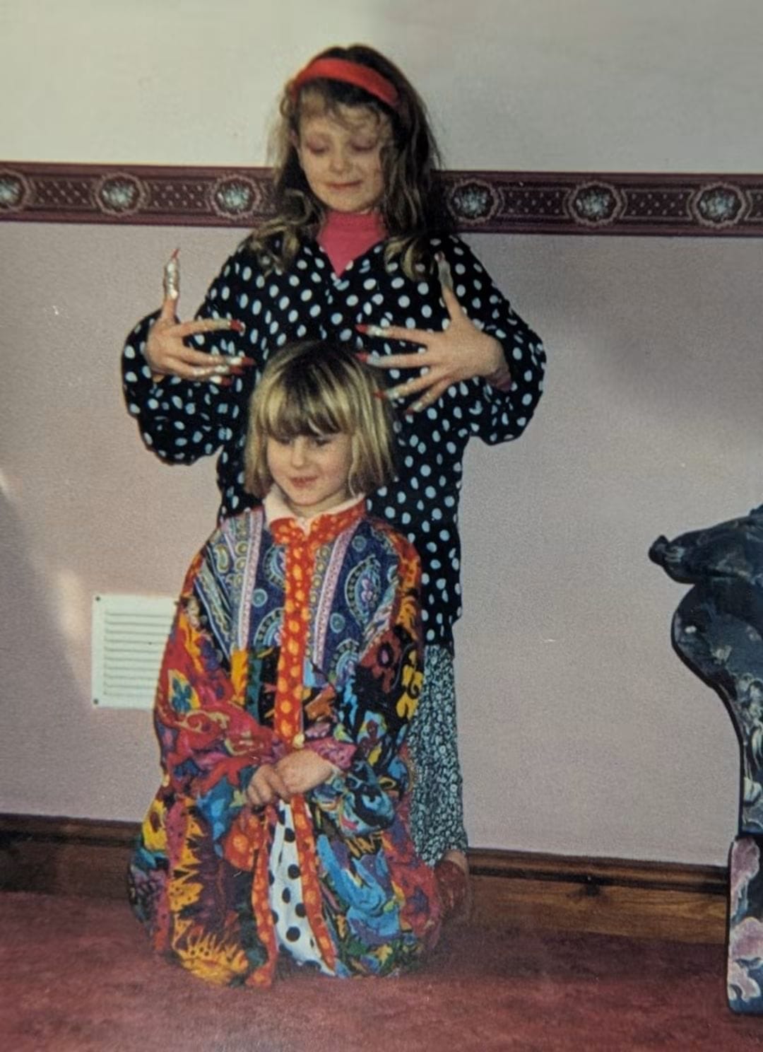 Adele and her younger sister dressing up as children